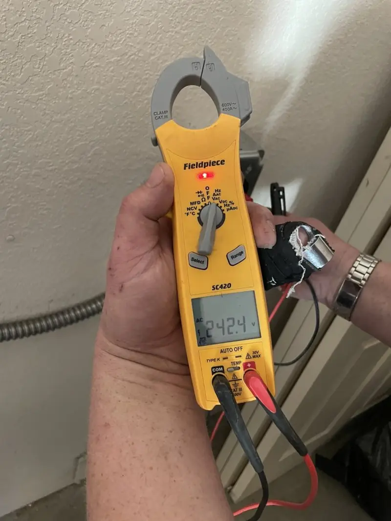 Voltage testing with clamp meter during Electrical Installation Services in Rainbow Springs